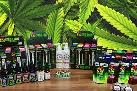 All the products of CBD Lion with a cannabis leaf in the background