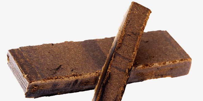 A large and small rectangular brown bar of the hashish CBD concentrate