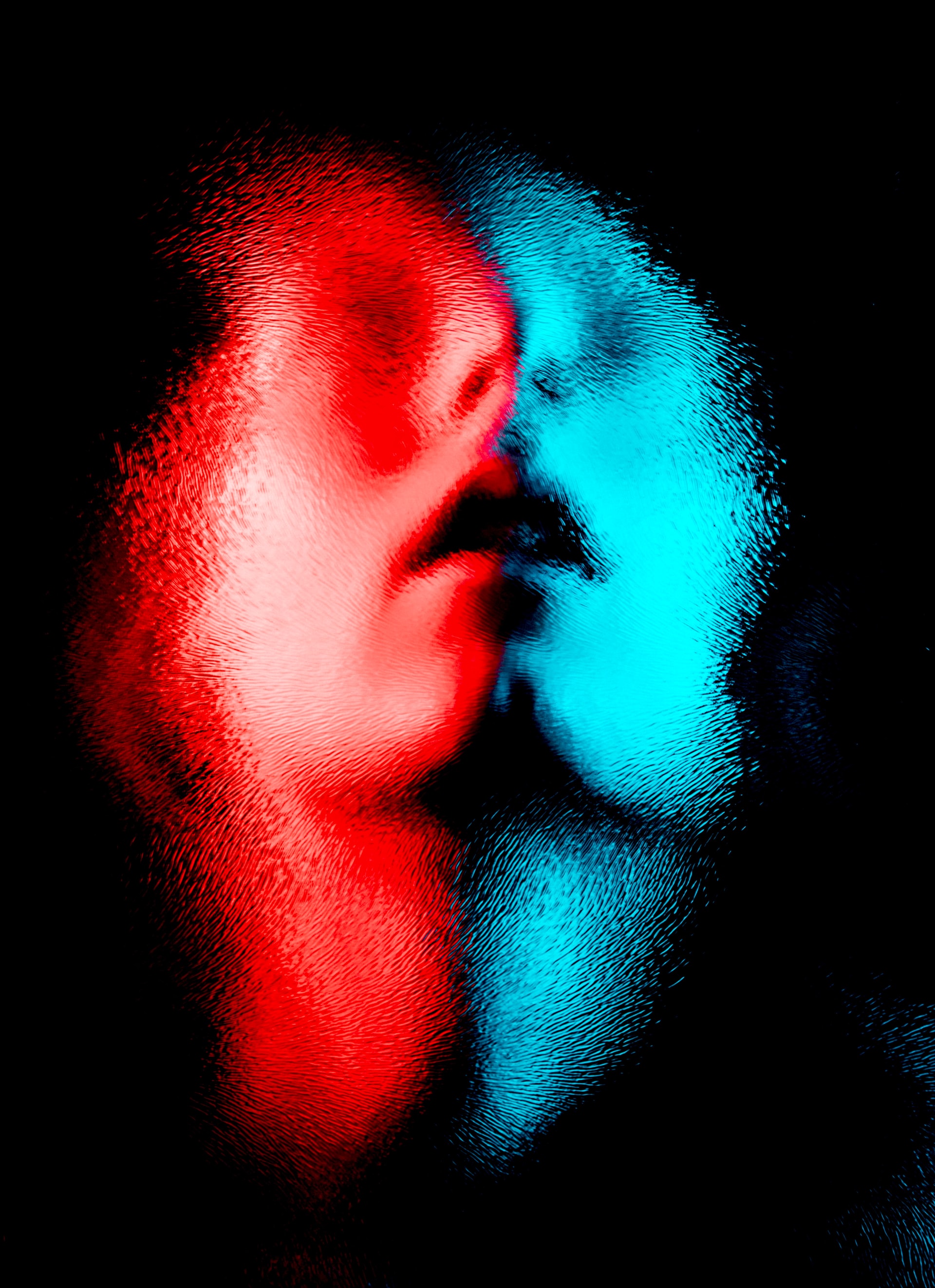 Painting of human face in red and blue color