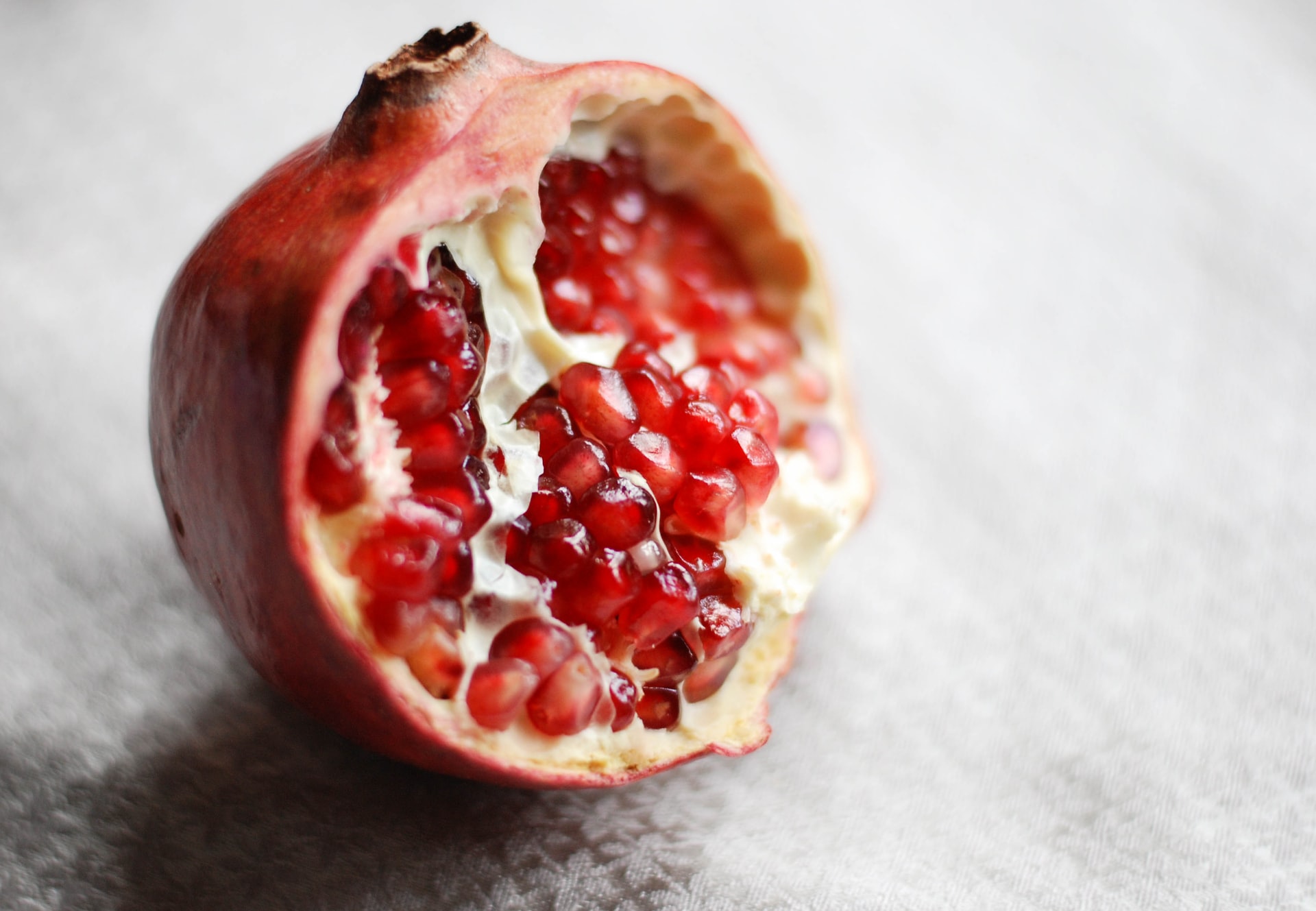 Halved Pomegranate placed on a table
