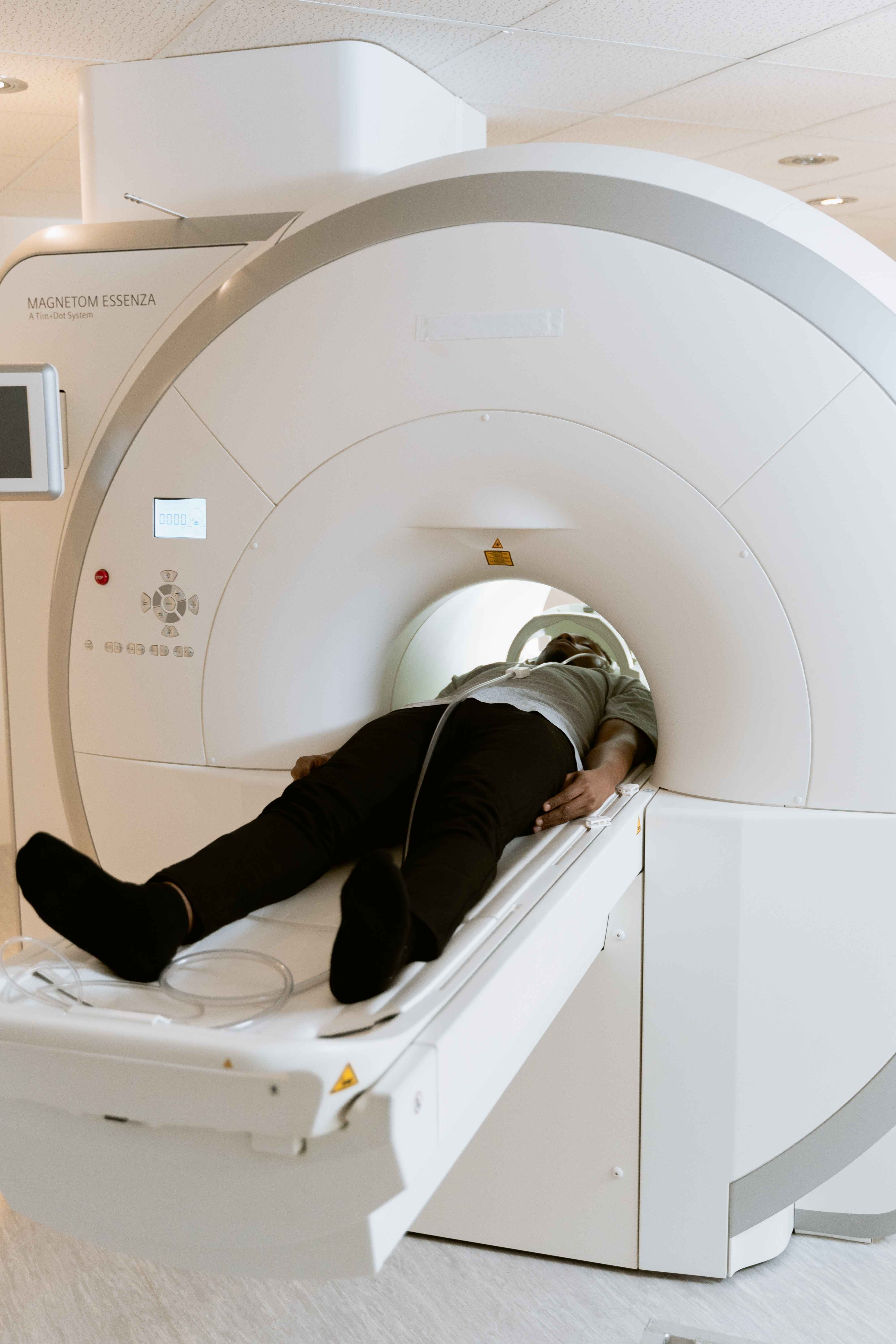 A patient is lying in a CT scan machine