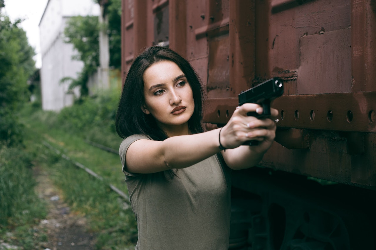 Woman Pointing a Gun